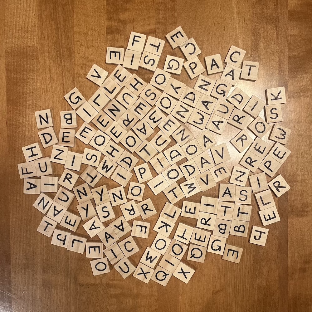 A complete Banagrams set spread out on a table.